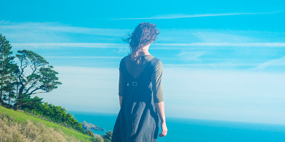 940x470-Youngwomanonhilltopbythesea.jpg